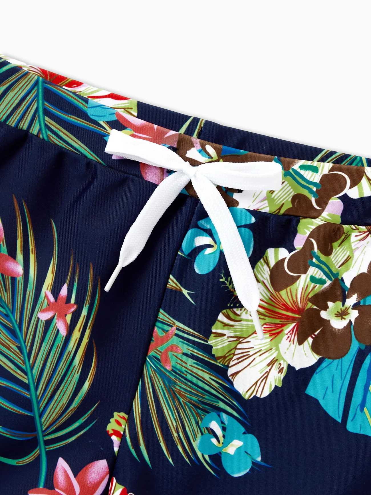Family Matching Tropical Leaf and Flora Print Blue Swim Trunks or 2 Pieces Tie Front Tankini Swimsuit
Family Matching Tropical Leaf and Flora Print Blue Swim Trunks or 2 Pieces Tie Front Tankini Swimsuit