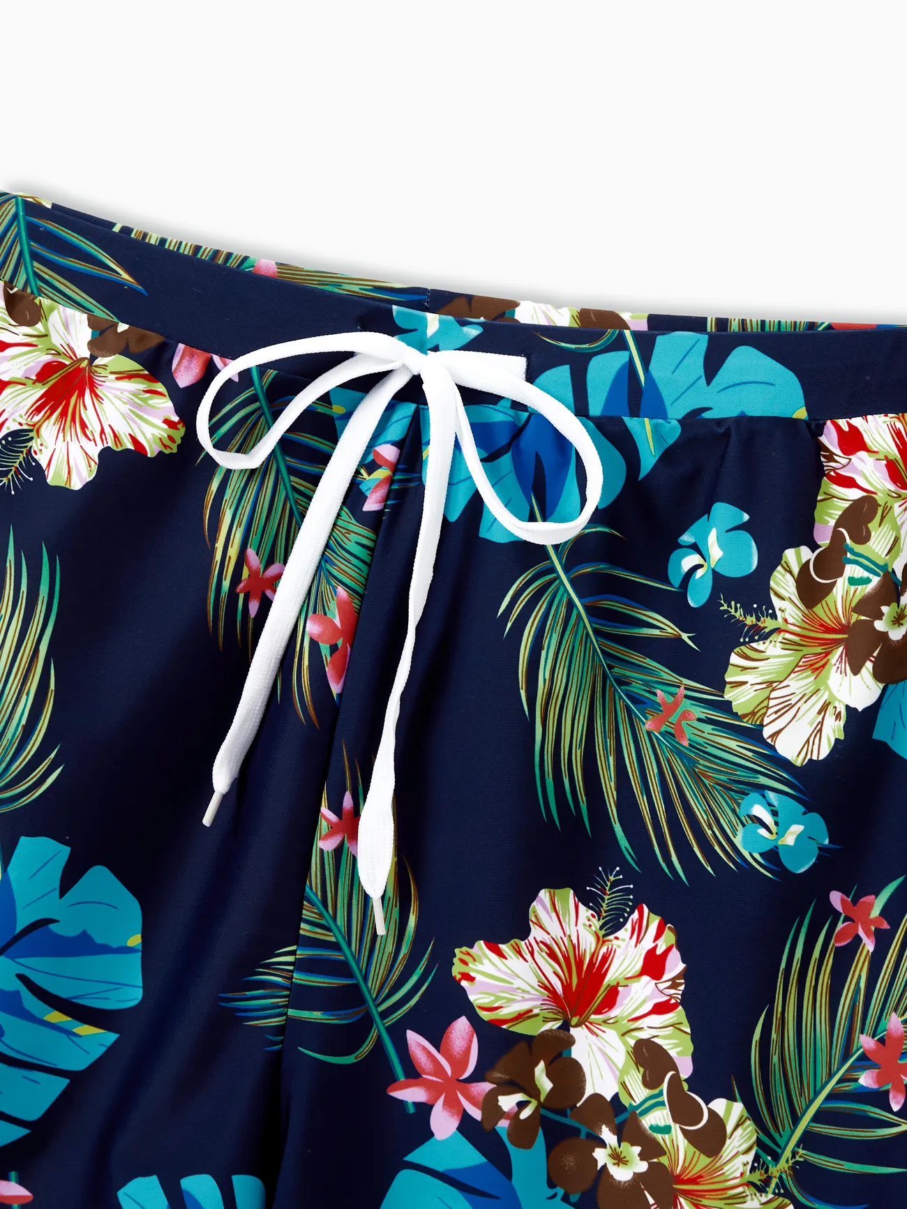 Family Matching Tropical Leaf and Flora Print Blue Swim Trunks or 2 Pieces Tie Front Tankini Swimsuit
Family Matching Tropical Leaf and Flora Print Blue Swim Trunks or 2 Pieces Tie Front Tankini Swimsuit