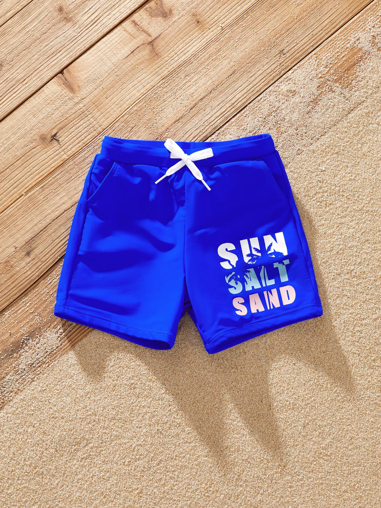 Family Matching Swimsuits 'Sun Salt Sand' Graphic Blue One-Piece Swimwear & Swim Trunks
Family Matching Swimsuits 'Sun Salt Sand' Graphic Blue One-Piece Swimwear & Swim Trunks
