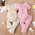 2pcs Baby Girl Solid Swiss Dot Ruffle Short-sleeve Bowknot Romper and Ribbed Bell Bottom Pants Set Pink