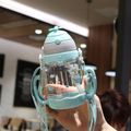 450ML Straw Water Cup Water Bottle with Scale Cartoon Portable Straw Water Bottle Sippy Cup with Lanyard (Random Graphic) Light Green image 4