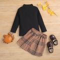 2-piece Toddler Girl Mock Neck Ribbed Long-sleeve Black Top and Button Design Plaid Skirt Set Black image 3