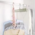 Perchas mágicas de múltiples puertos, estante de almacenamiento de ropa de plástico multifunción para ahorrar espacio Blanco image 2