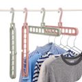 Perchas mágicas de múltiples puertos, estante de almacenamiento de ropa de plástico multifunción para ahorrar espacio Blanco image 3