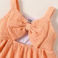 Baby Girl Solid Textured Sleeveless Bowknot Hollow Out Dress Orange image 4