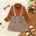 2pcs Toddler Girl Turtleneck Ribbed Long-sleeve Tee and Button Design Plaid Suspender Skirt Set Brown image 1