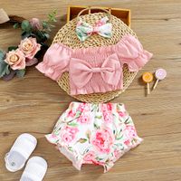 3pcs Baby Girl Pink Off Shoulder Puff-sleeve Bowknot Shirred Crop Top and Floral Print Shorts with Headband Set
