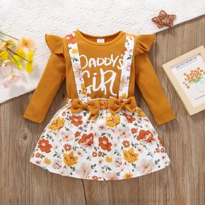 2-piece Toddler Girl Letter Print Ruffled Long-sleeve Ribbed Top and Bowknot Design Floral Print Suspender Skirt Set