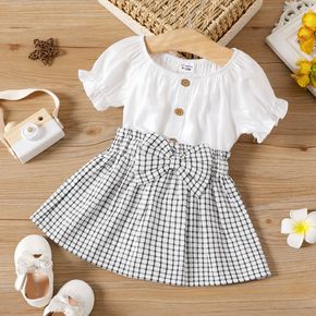 2pcs Baby Girl Solid Puff-sleeve Loose Fit Top and Bow Front Plaid Skirt Set