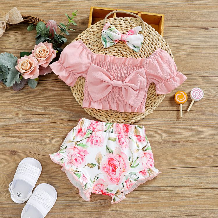 3pcs Baby Girl Pink Off Shoulder Puff-sleeve Bowknot Shirred Crop Top and Floral Print Shorts with Headband Set Light Pink