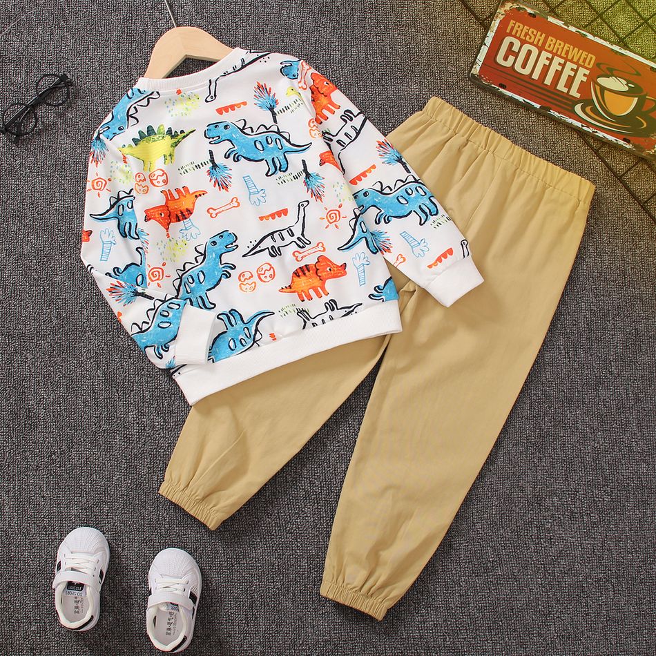 2pcs Kid Boy Animal Dinosaur Print Pullover Sweatshirt and 100% Cotton Pocket Design Pants Set OffWhite