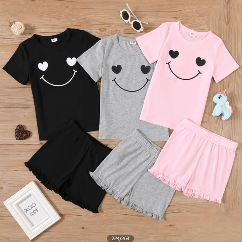 

2pcs Kid Girl Smiley Print Short-sleeve Tee and Ruffle Hem Shorts
