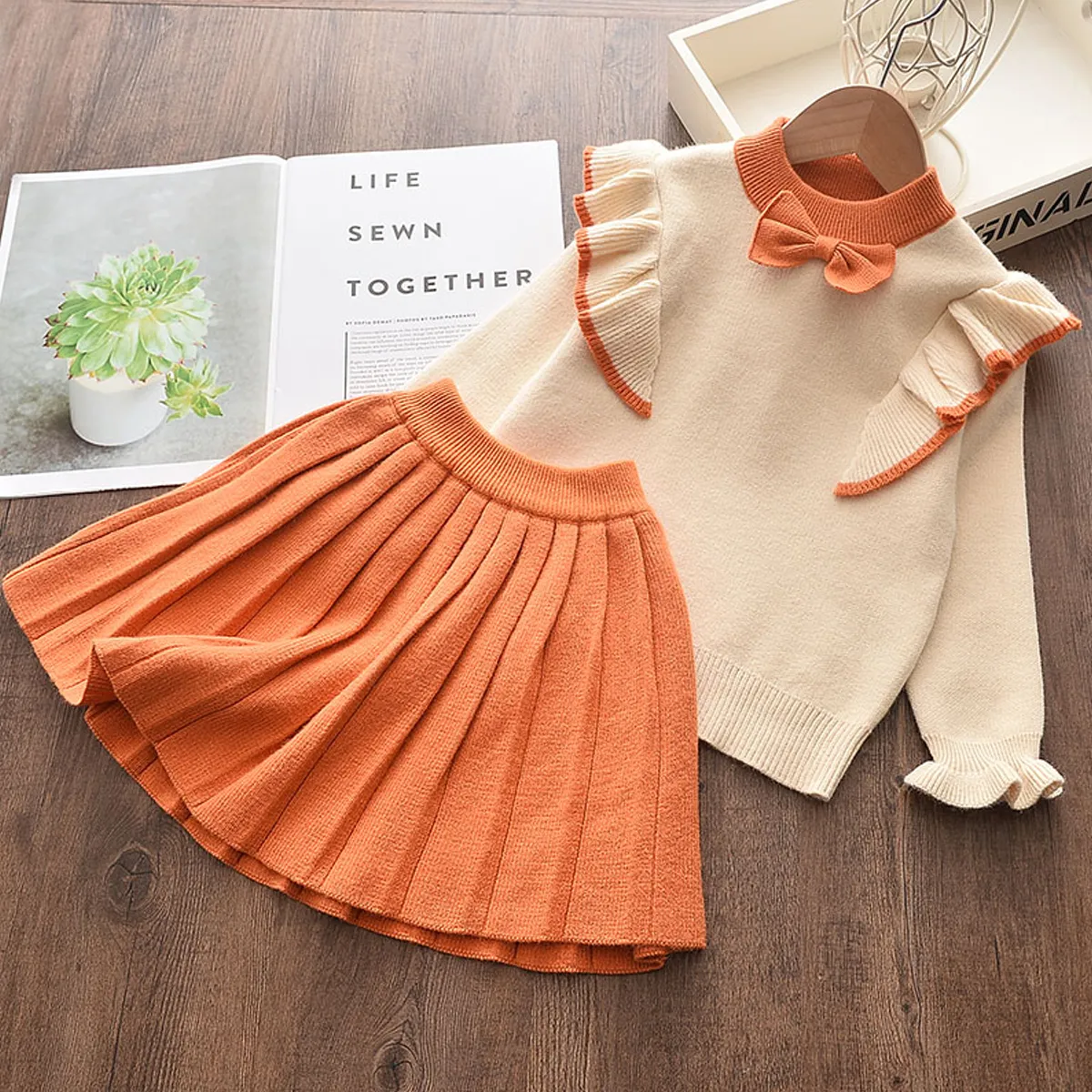 2pcs Baby Girl Bow Front Ruffle Trim Long-sleeve Knitted Sweater and Pleated Skirt Set Orange big image 1