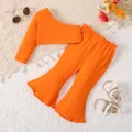 2pcs Baby Girl Solid One-Shoulder Cotton Top and Flared Pants Set  image 1