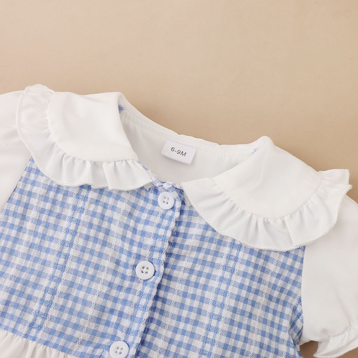 

2pcs Baby Girl 95% Cotton Ripped Denim Shorts and Plaid Splicing Peter Pan Collar Puff-sleeve Button Up Top Set