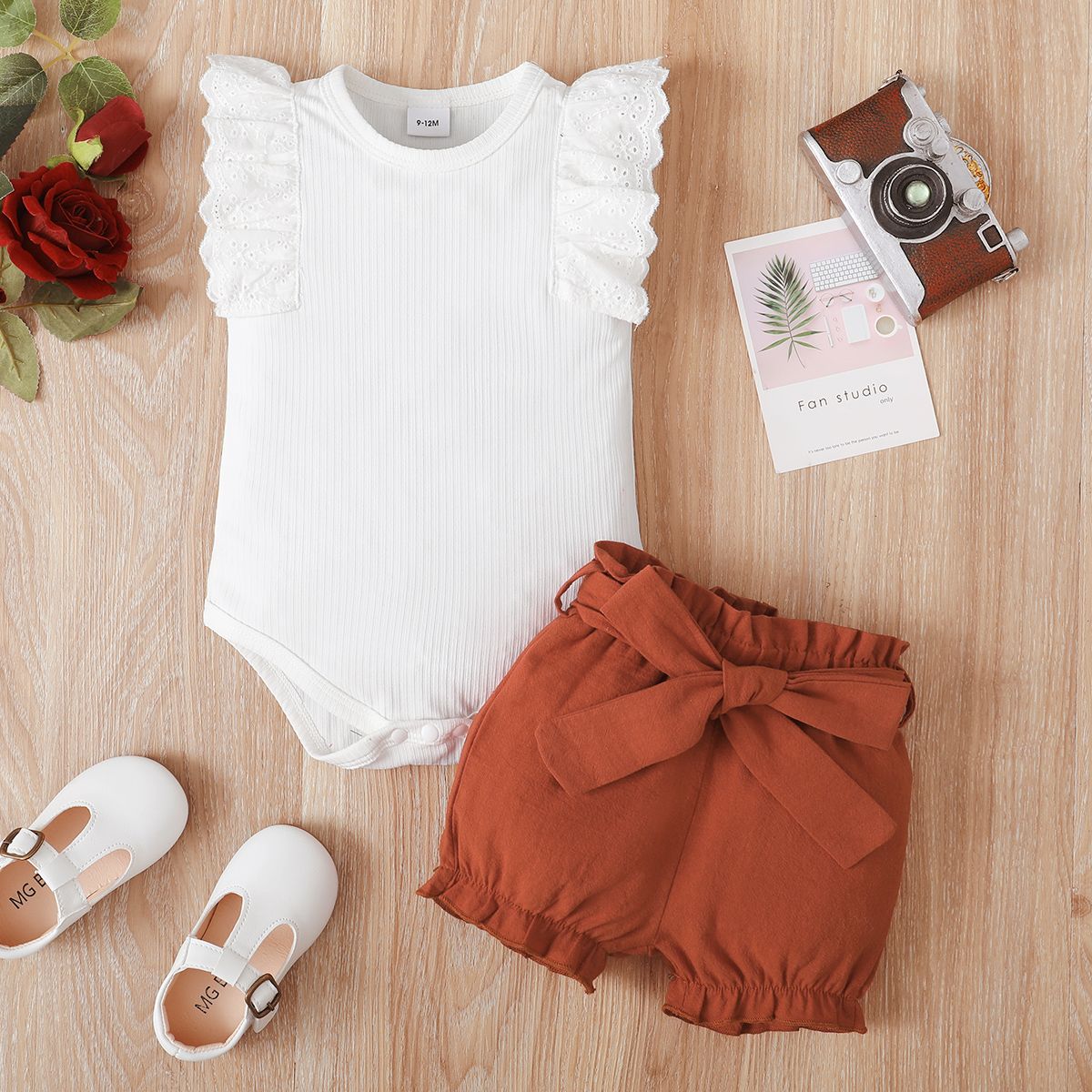 

2pcs Baby Girl 100% Cotton Solid Belted Shorts and Ruffle Trim Ribbed Tank Romper Set