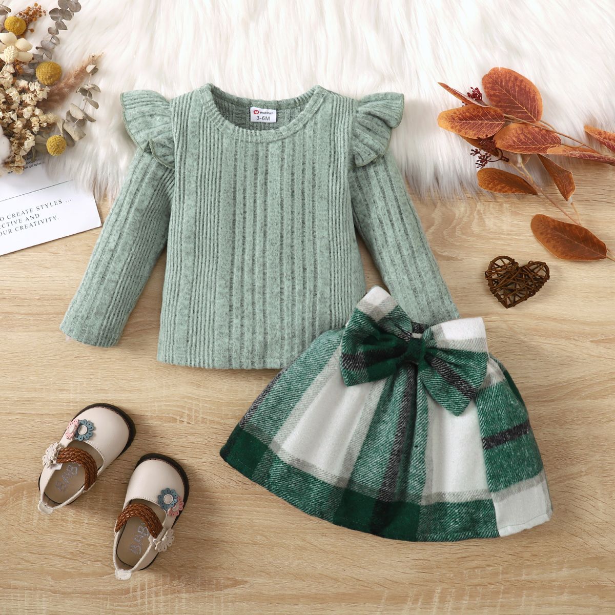 

2pcs Baby Girl Texture Ruffle Solid Long-sleeve Top and Bow Decor Plaid Skirt Set