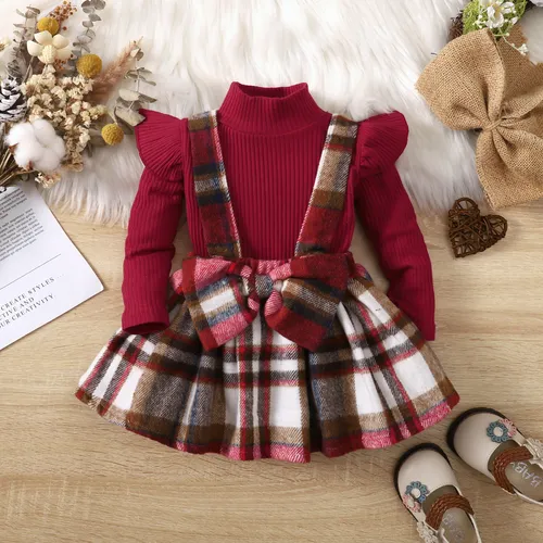 2pcs Baby Girl 95% Cotton Ribbed Solid Ruffle Long-sleeve Top and Plaid Bow Decor Strappy Skirt Set
