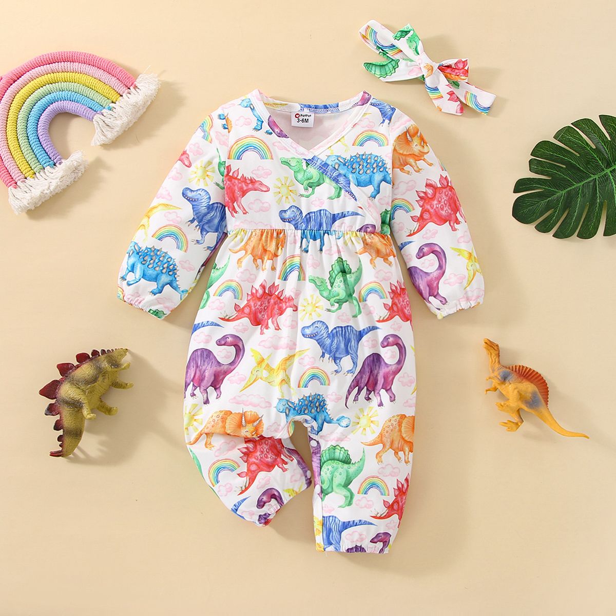 

2pcs Baby Girl Allover Colorful Dinosaur Print Long-sleeve Jumpsuit with Headband Set