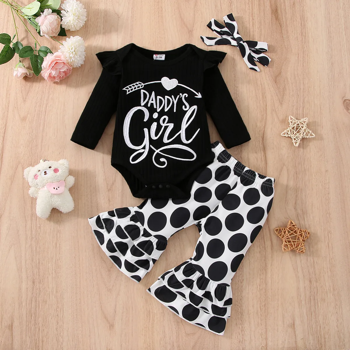 

3pcs Baby Girl Letter Embroidered Black Ribbed Ruffle Long-sleeve Romper and Polka Dots Flared Pants with Headband Set