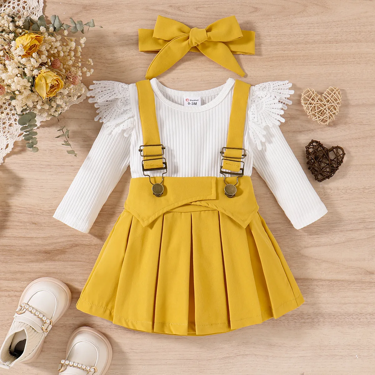 

3pcs Baby Girl Solid Cotton Ribbed Lace Detail Long-sleeve Romper and Pleated Suspender Skirt & Headband Set