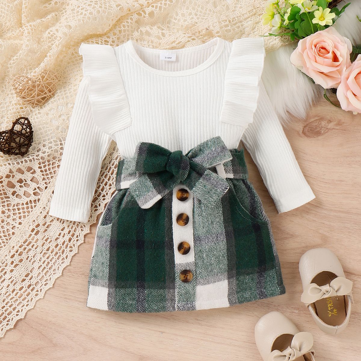 2pcs Baby Girl Solid Rib Knit Ruffle Trim Long-sleeve Romper and Button Front Plaid Belted Skirt Set