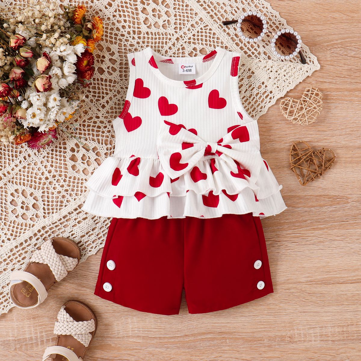 

2pcs Baby Girl Allover Heart Print Bow Front Ruffle Hem Tank Top and Shorts Set