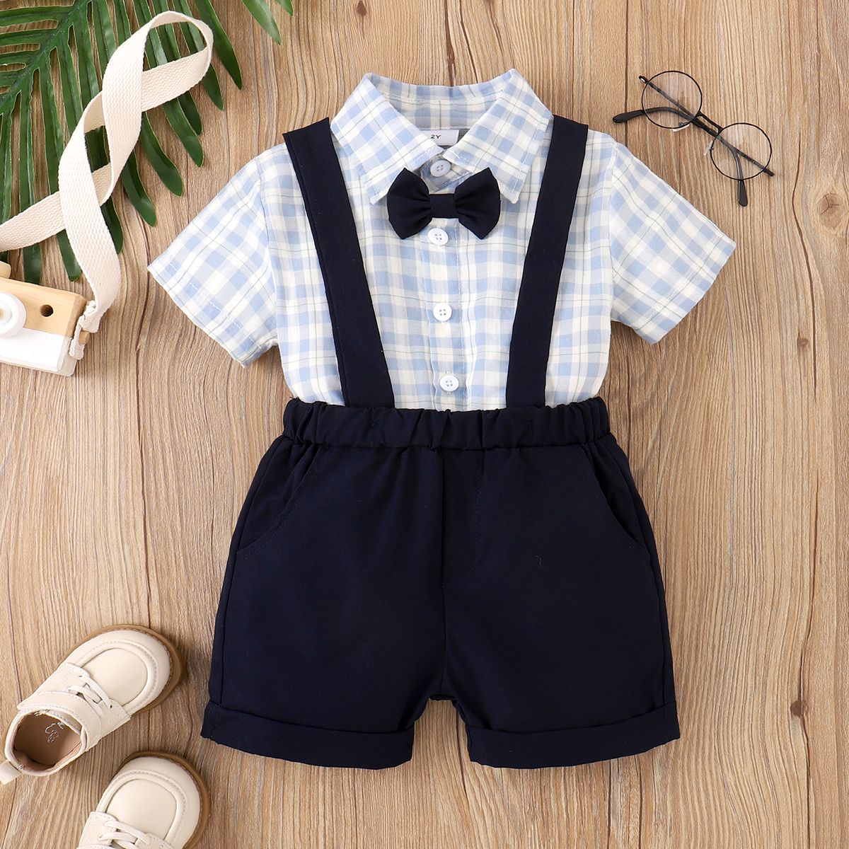 

2pcs Toddler Boy Bow Tie Decor Plaid Shirt and Solid Suspender Shorts Set