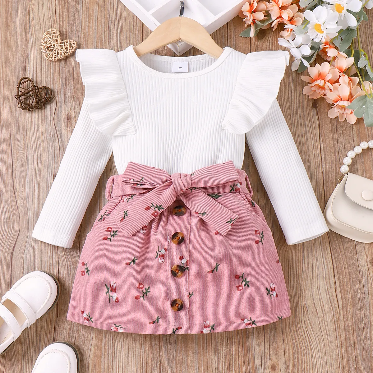 

2pcs Toddler Girl 95% Cotton Ruffle Ribbed Solid Long-sleeve Tee and Allover Floral Print Belted Skirt Set