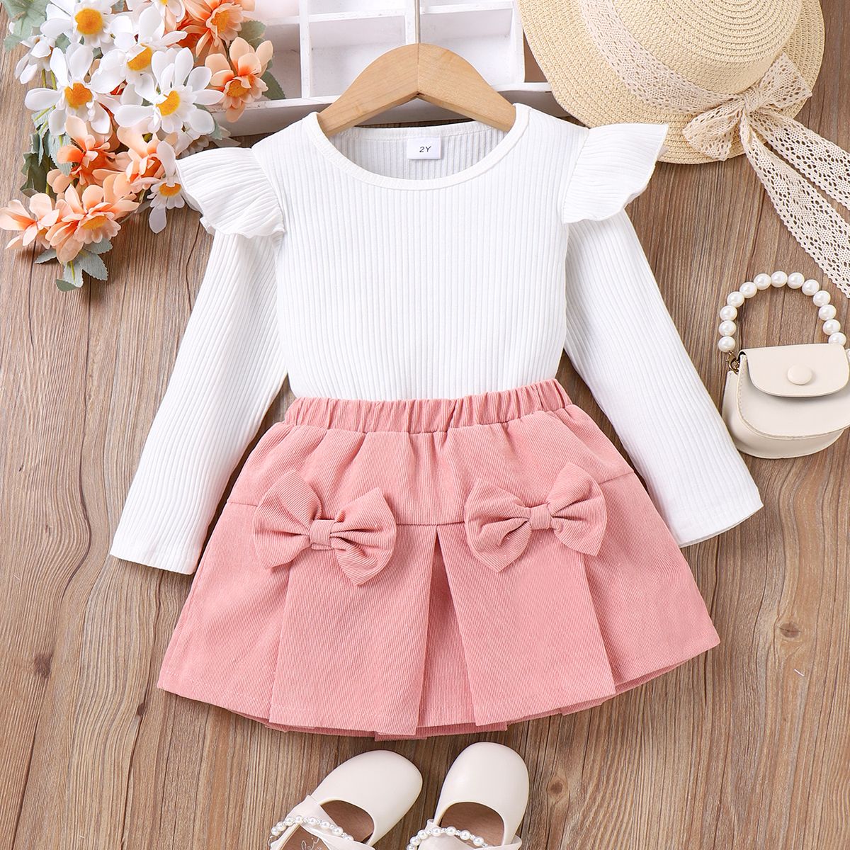 

2pcs Toddler Girl 95% Cotton Ribbed Ruffle Long-sleeve Top and Bow Decor Skirt Set
