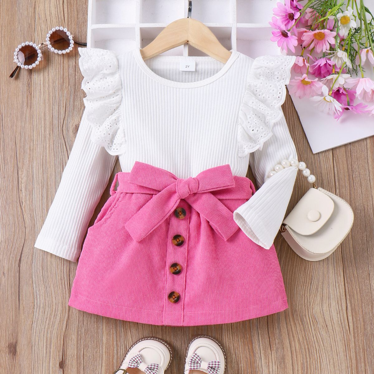 

2pcs Toddler Girl 95% Cotton Eyelet Embroidery Long-sleeve Ribbed Top and Buttons Front Belted Pockets Skirt Set