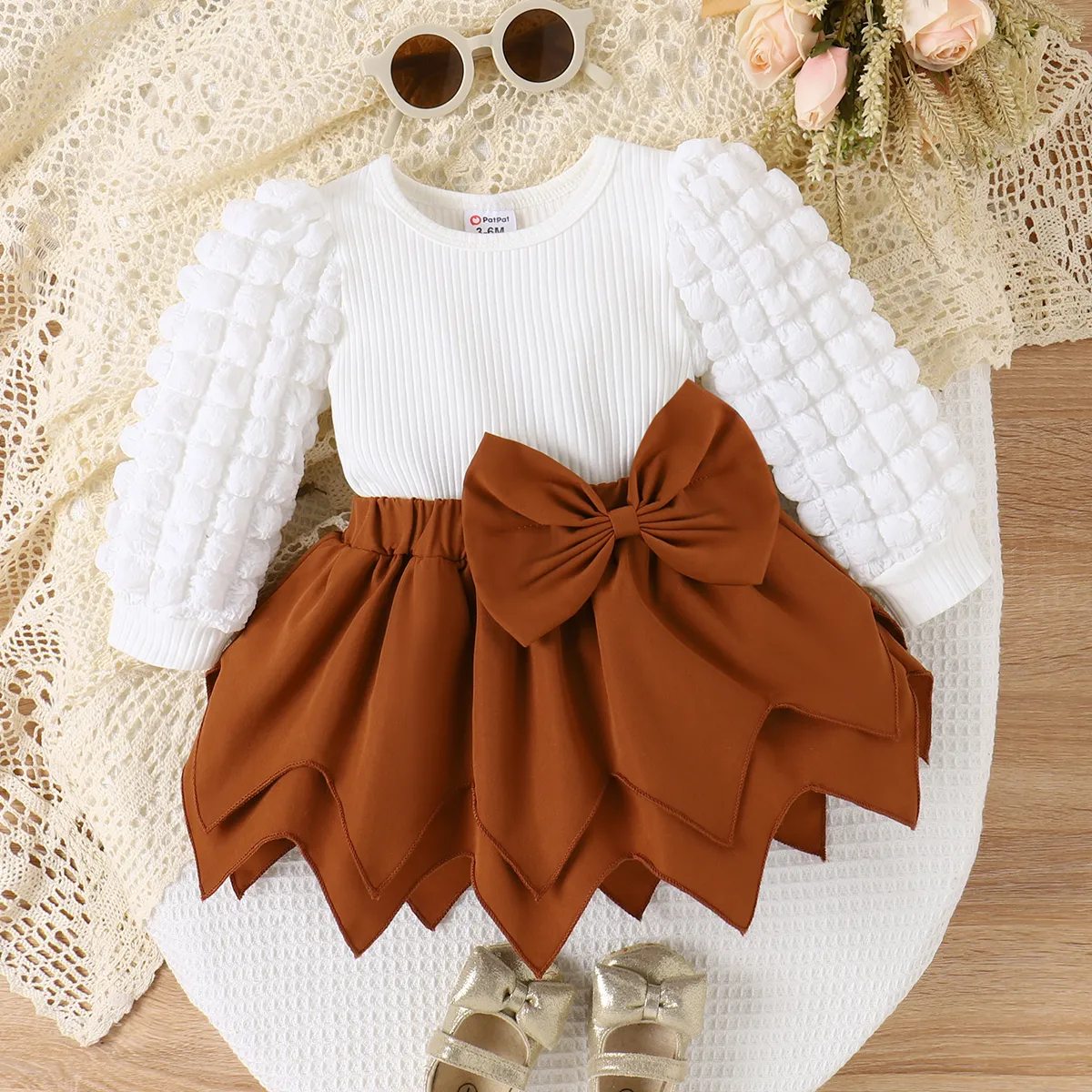 

Baby Girl 95% Cotton Textured Puff-sleeve Ribbed Top and Bow Decor Handkerchief Skirt Set
