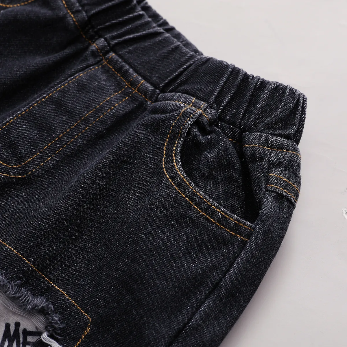 2pcs Baby Boy 95% Cotton Denim Ripped Jeans and All Over Graffiti Letter Print Long-sleeve Hoodie Set  image 5
