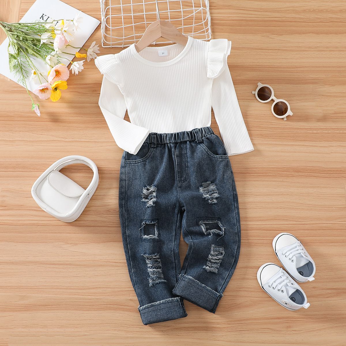 

2pcs Toddler Girl Trendy Cotton Ripped Denim Jeans and Ruffled Ribbed Tee Set