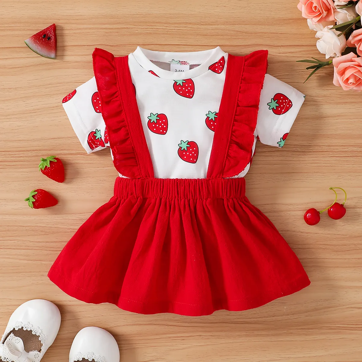 

2pcs Baby Girl 100% Cotton Ruffled Suspender Skirt and Allover Strawberry Print Short-sleeve Tee Set