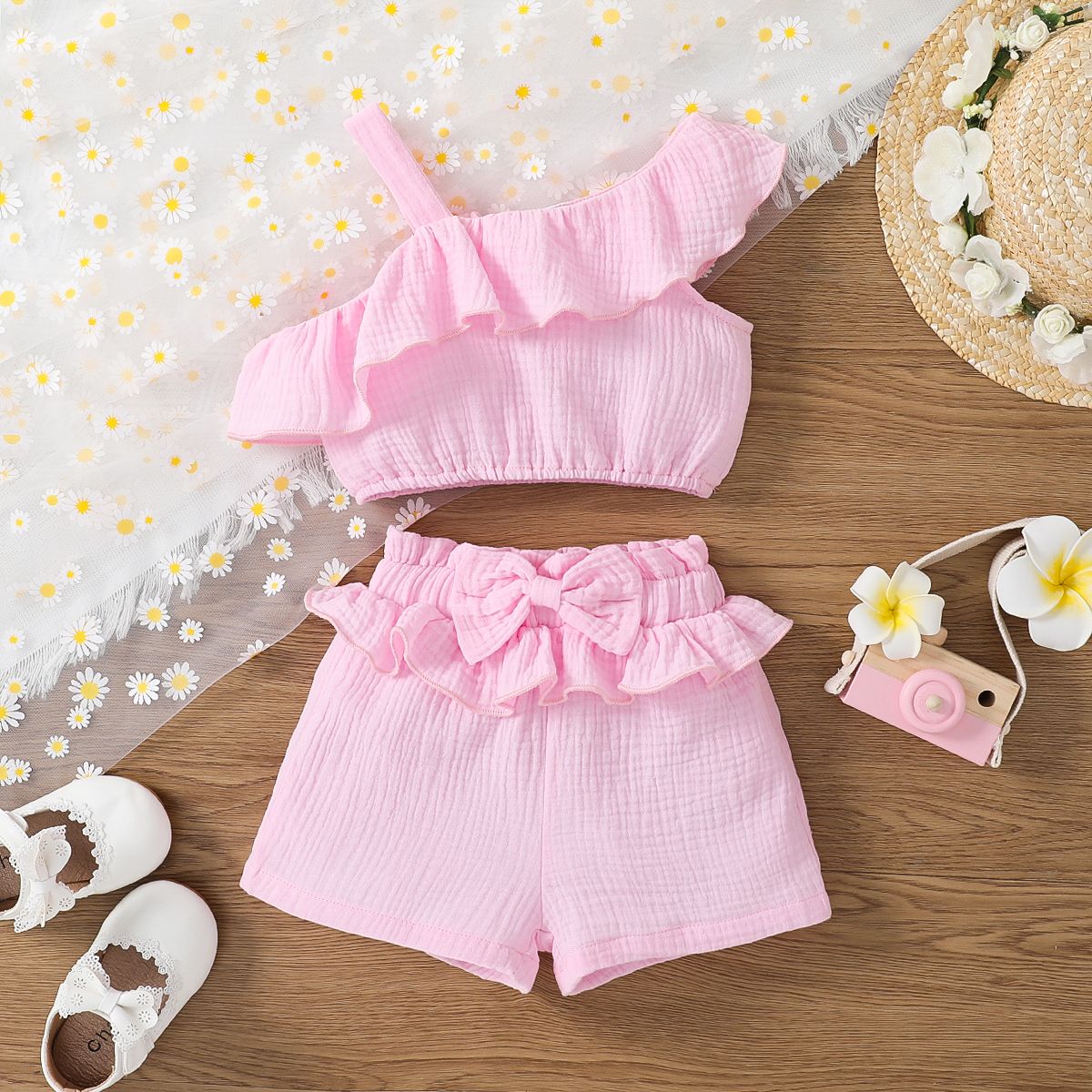 

2pcs Toddler Girl 100% Cotton Sweet One-Shoulder Ruffled Top and Bow Front Shorts Set