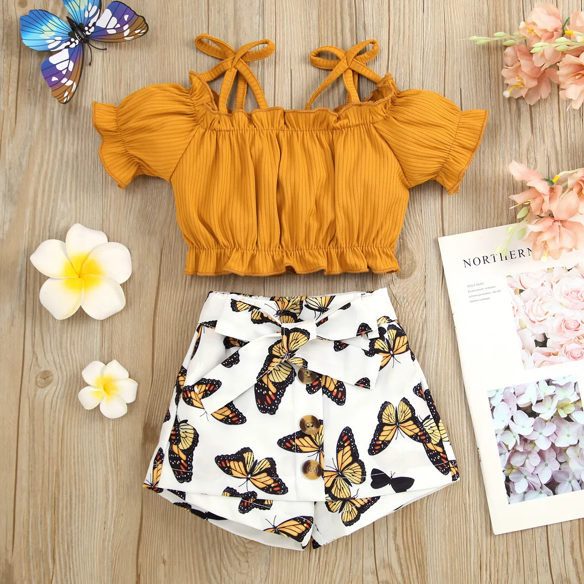 

2pcs Baby Girl Solid Rib Knit Spaghetti Strap Ruffle Puff-sleeve Top and Allover Butterfly Print Belted Shorts Set