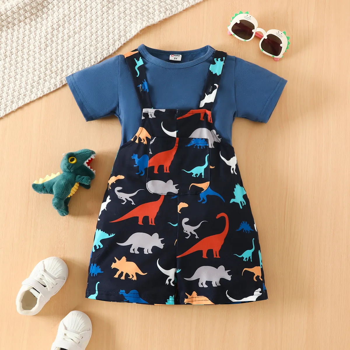 

2pcs Toddler Boy Solid Short-sleeve Tee and Allover Dinosaur Print Strappy Overalls