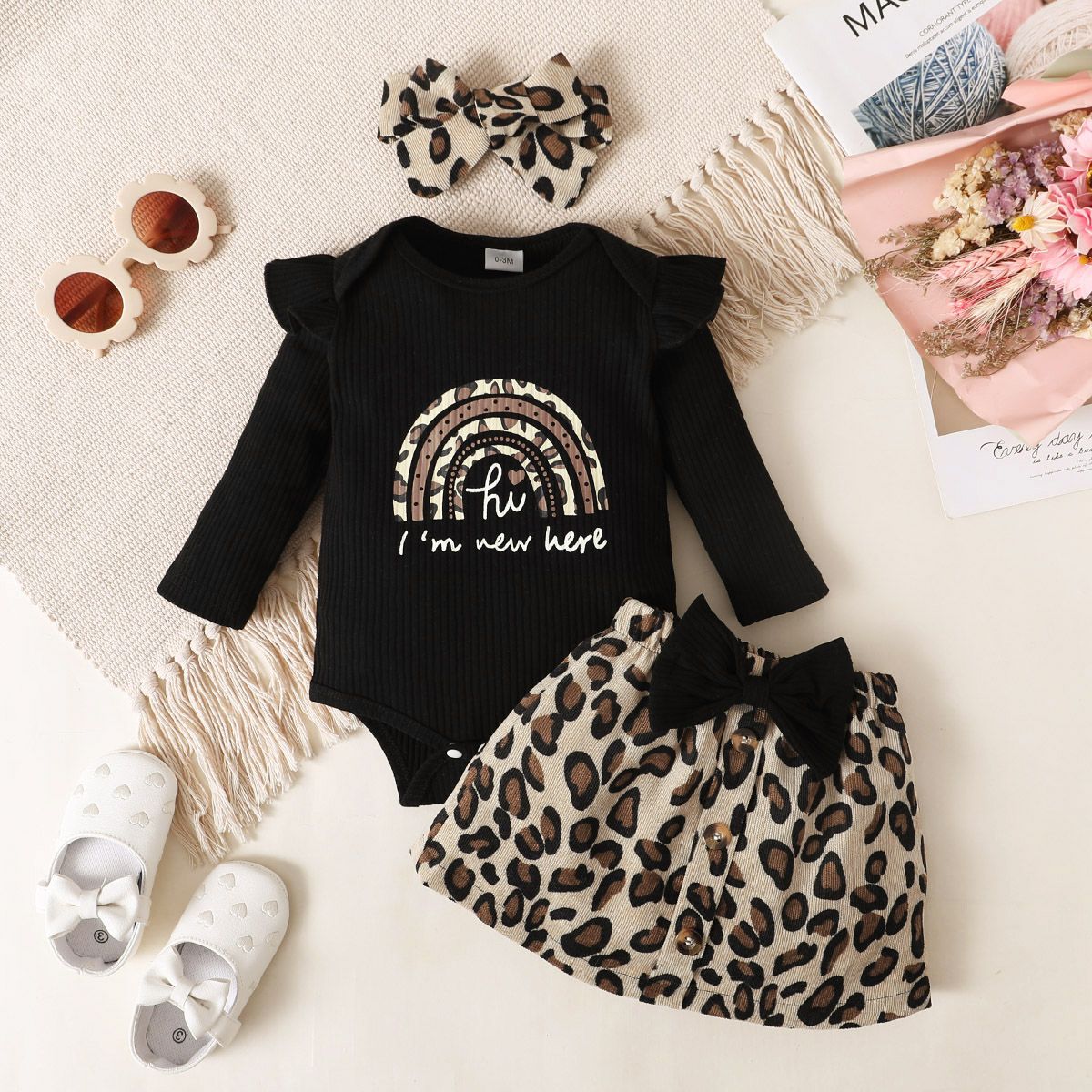 

3pcs Baby Girl Rainbow & Letter Print Black Ribbed Ruffle Long-sleeve Romper and Bow Front Leopard Skirt with Headband Set