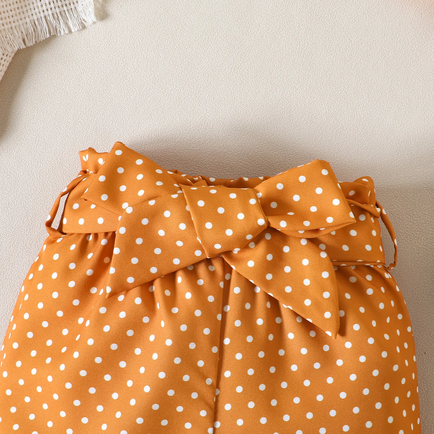 2pcs Baby Girl 95% Cotton One-Shoulder Ribbed Crop Camisole and Polka Dots Belted Shorts Set Apricot image 6