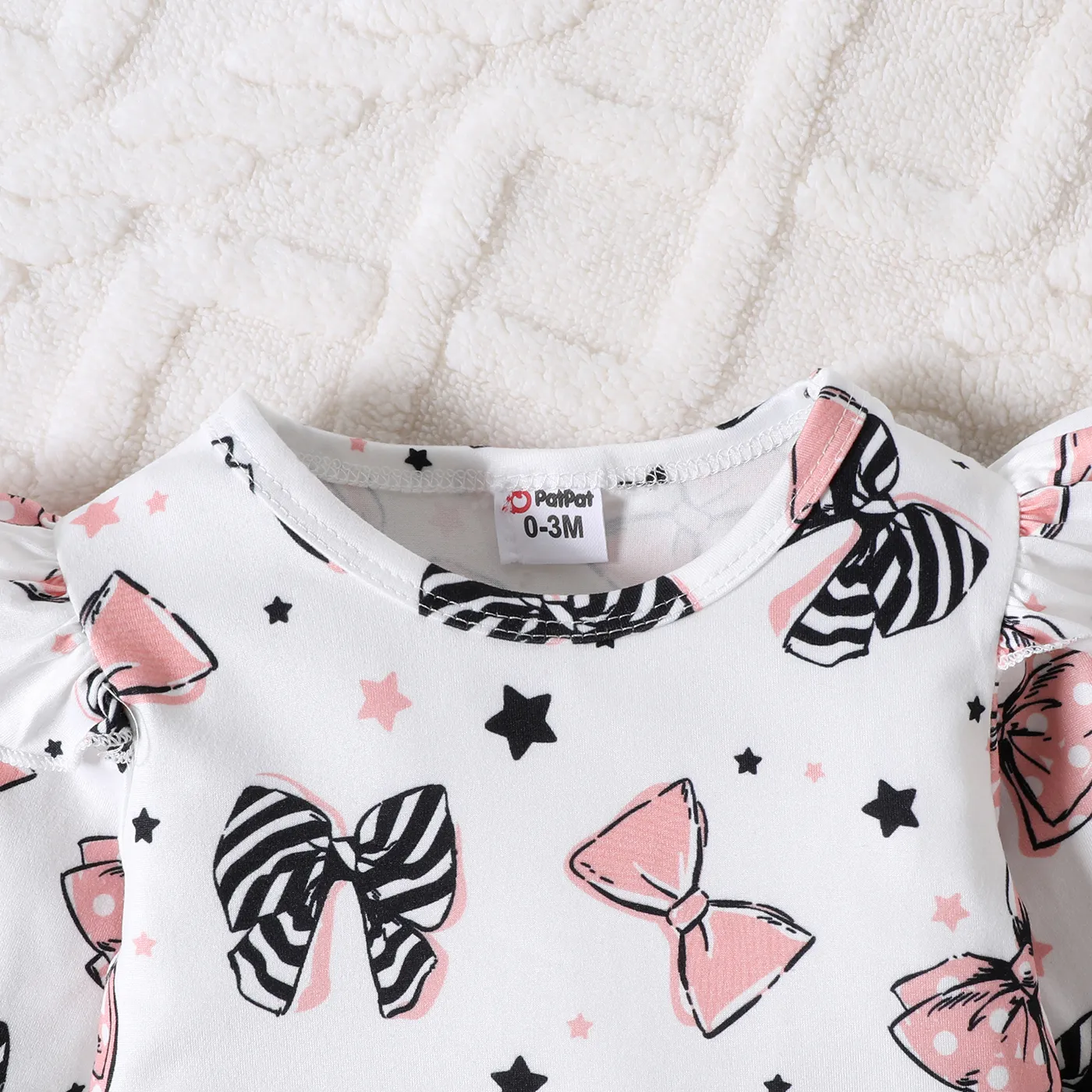 2pcs Baby Girl Allover Bowknot Print Ruffle Long-sleeve Romper and 100% Cotton Solid Bow Decor Skirt Set Pink image 4