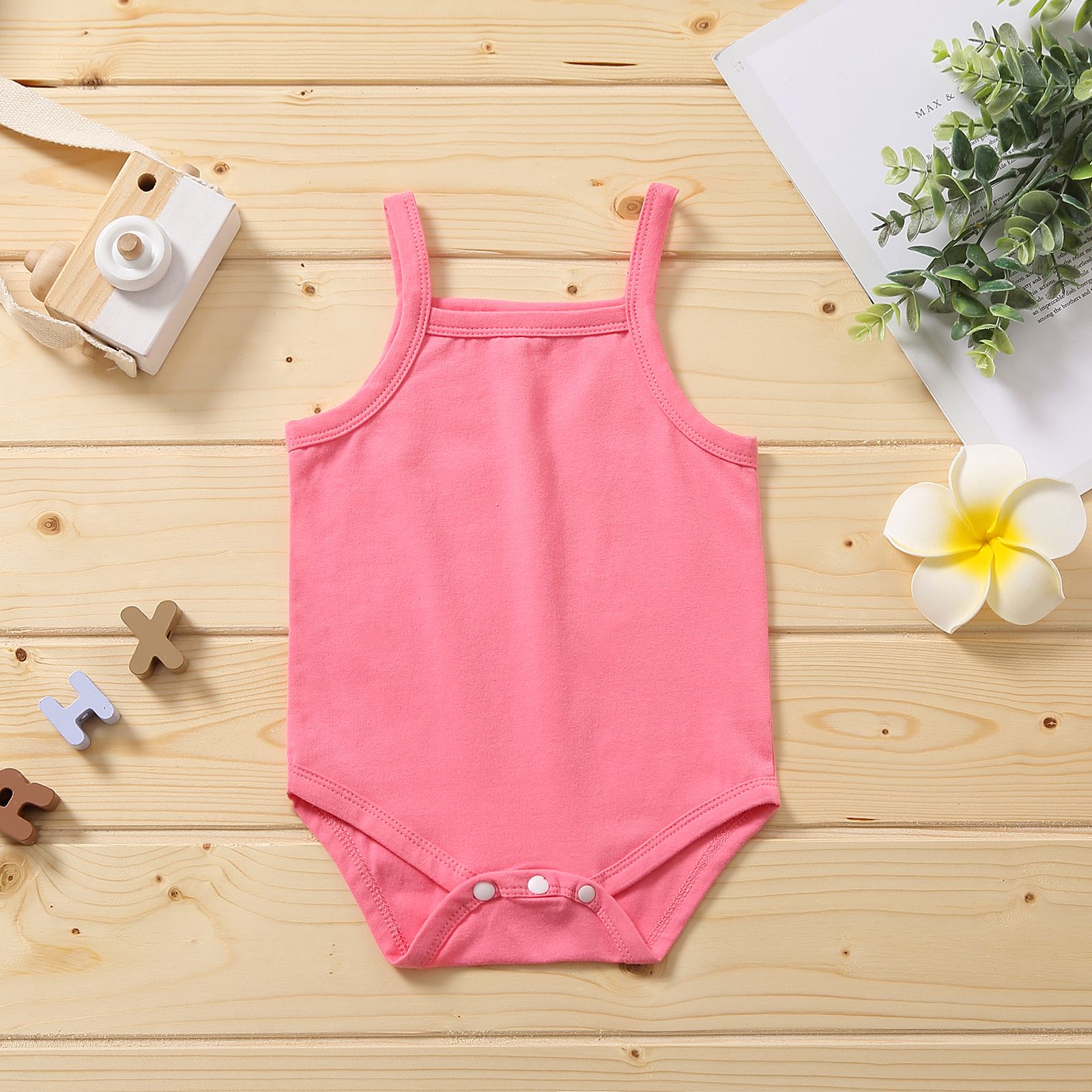 

Multi Color Solid Sleeveless Strappy Baby Romper