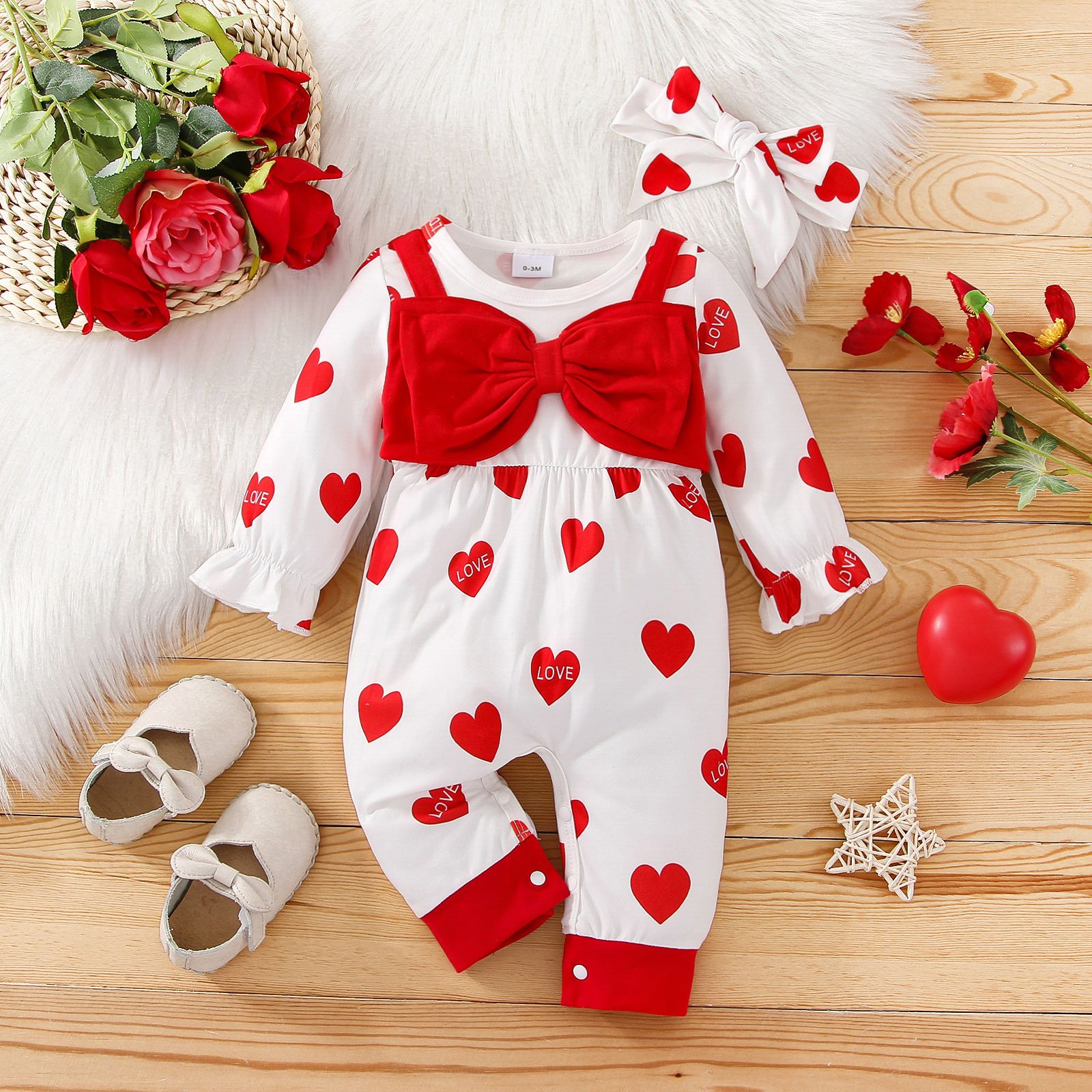 

Valentine's Day 2pcs Baby Girl Allover Heart Print Long-sleeve Bow Front Jumpsuit with Headband Set