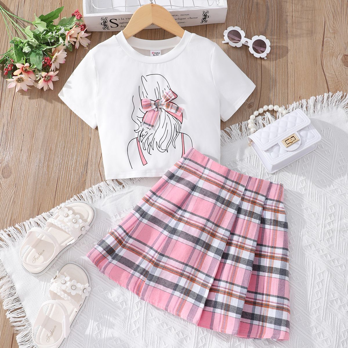 

2pcs Kid Girl Bow Decor Figure Print Short-sleeve Tee and Plaid Skirt Set