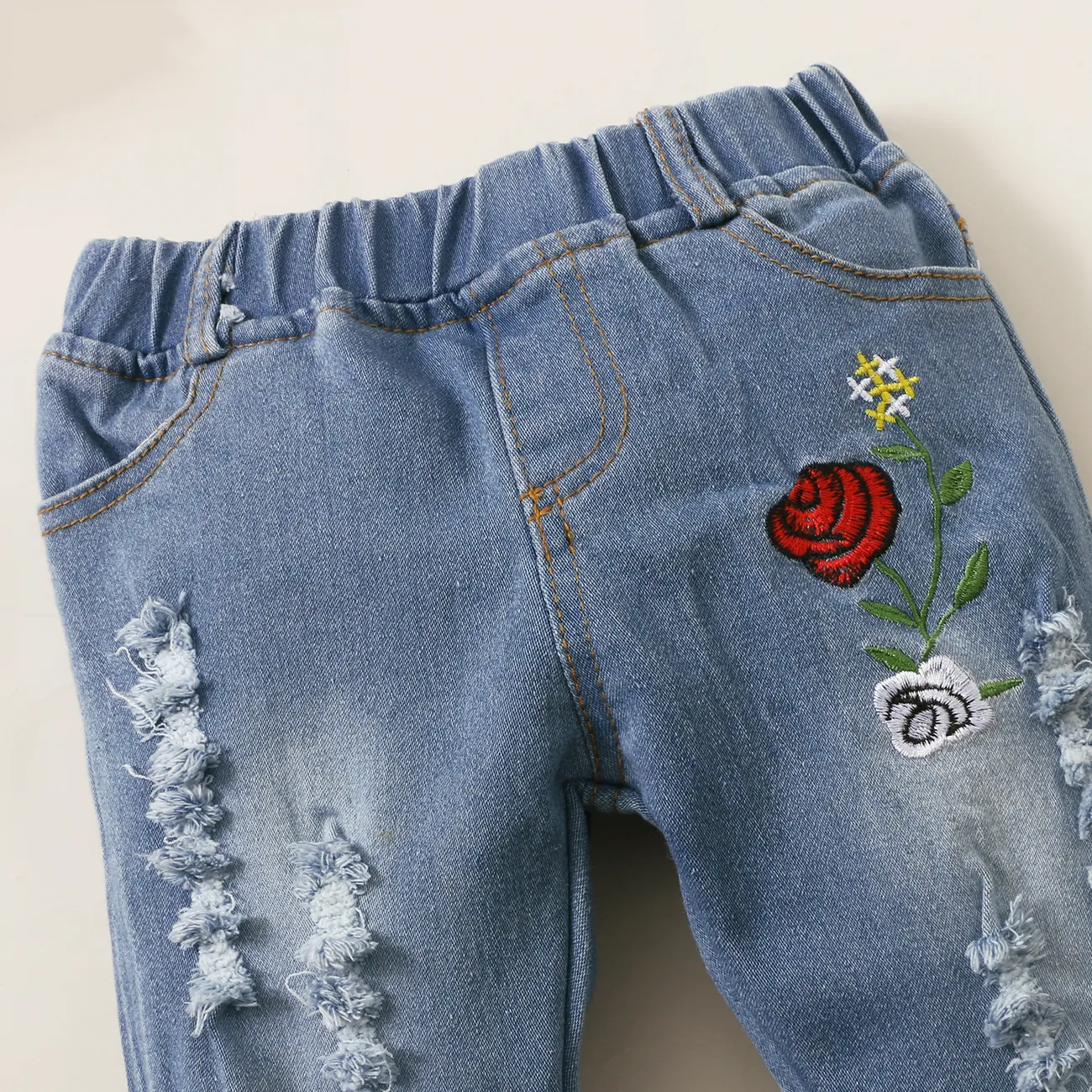 2pcs Baby Red Bell Sleeve Loose-fit Top and Floral Embroidered Ripped Denim Jeans Set Red big image 1