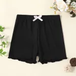 Pantalones cortos de polainas de color sólido con ribete de lechuga con diseño de lazo para niña Negro