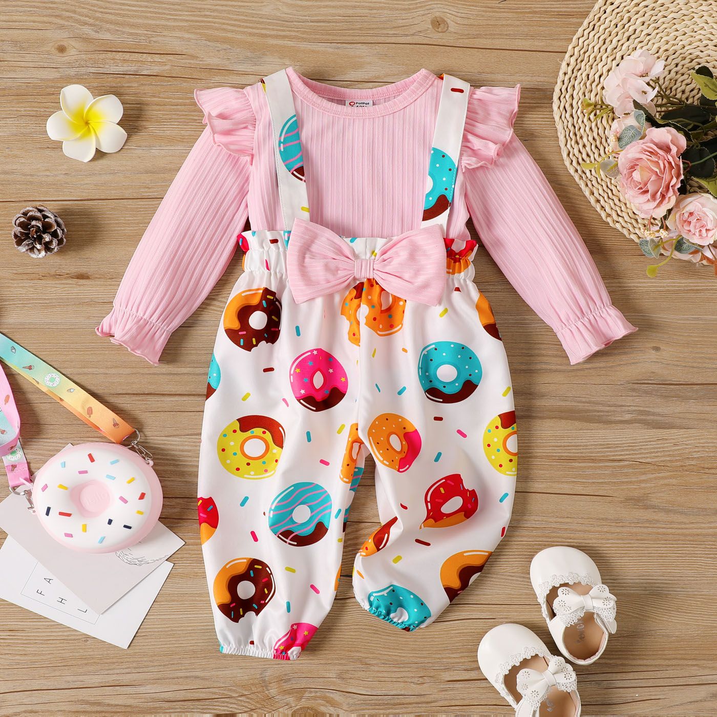 

2pcs Baby Girl Rib Knit Ruffle Long-sleeve Top and Bow Front Allover Donut Print Overalls Set