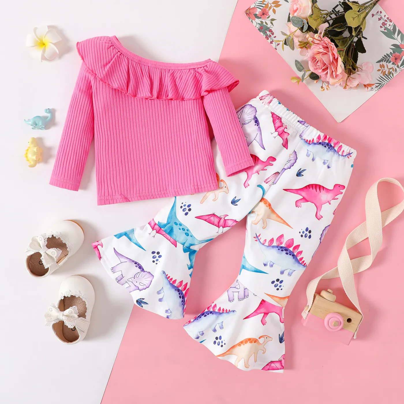 

2pcs Baby Girl Rib Knit Ruffle Trim One Shoulder Long-sleeve Top and Allover Dinosaur Print Flared Pants Set
