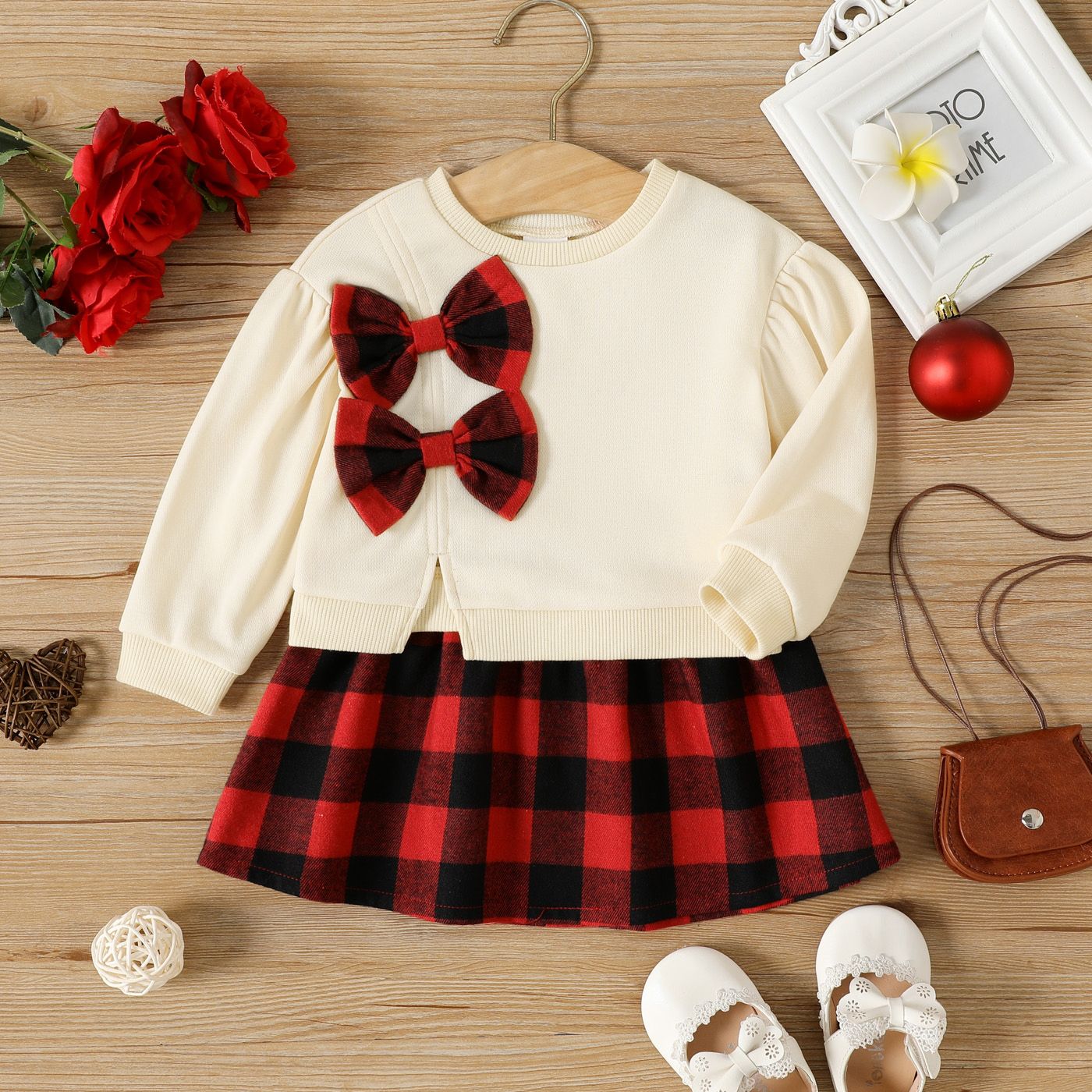 

2pcs Baby Girl Bow Front Puff-sleeve Split Hem Sweatshirt and Plaid Skirt Set