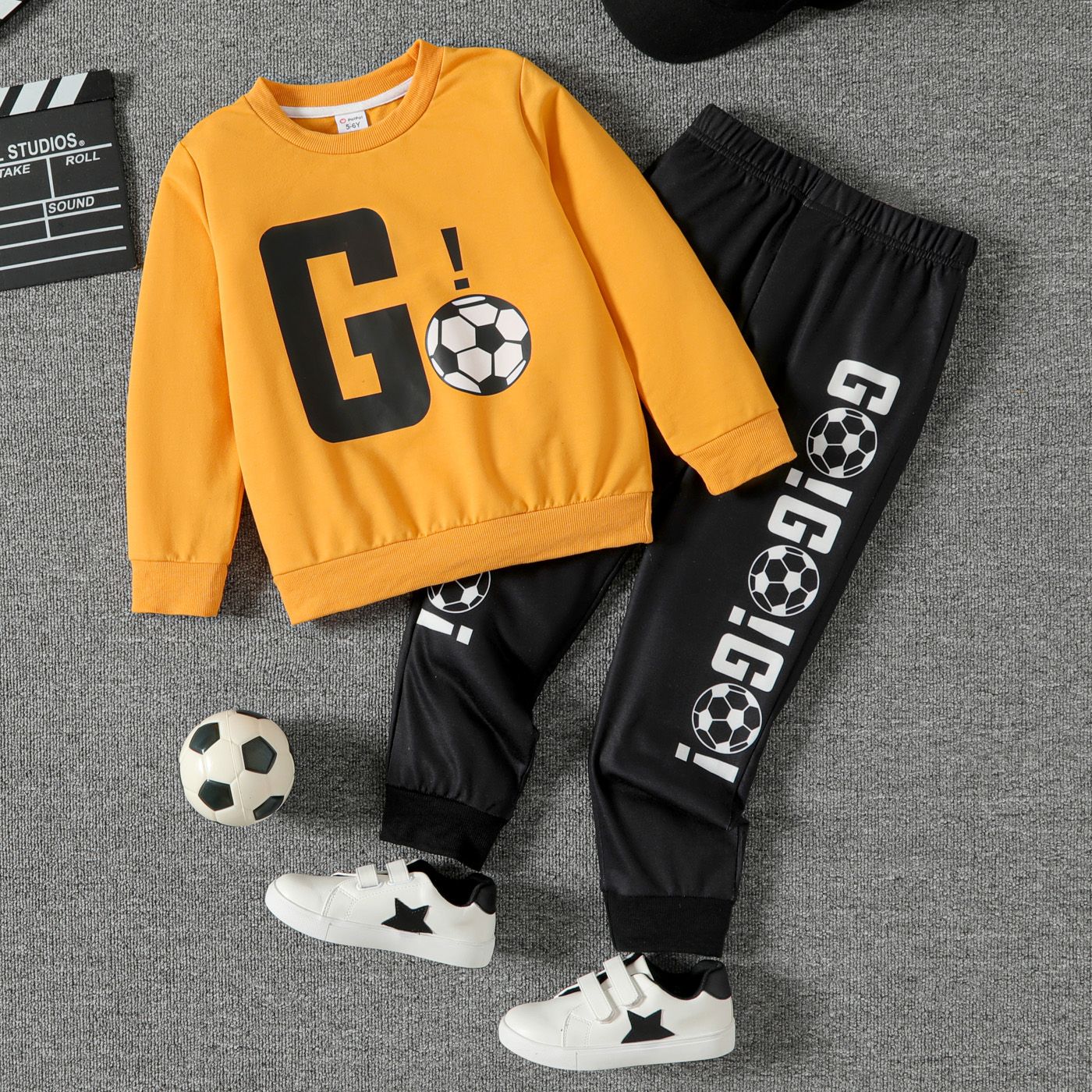 

2pcs Kid Boy Soccer Print Pullover Sweatshirt and Elasticized Black Pants Set